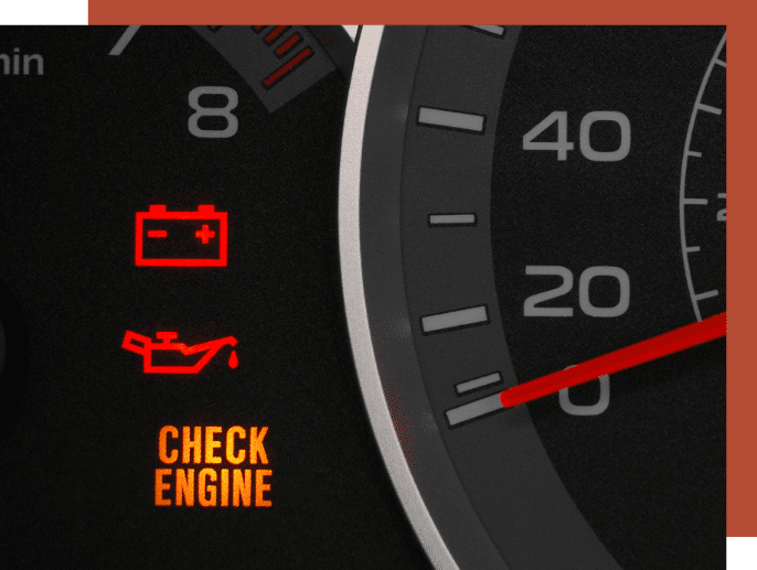 closeup of dashboard in a car. Check engine light is on. 